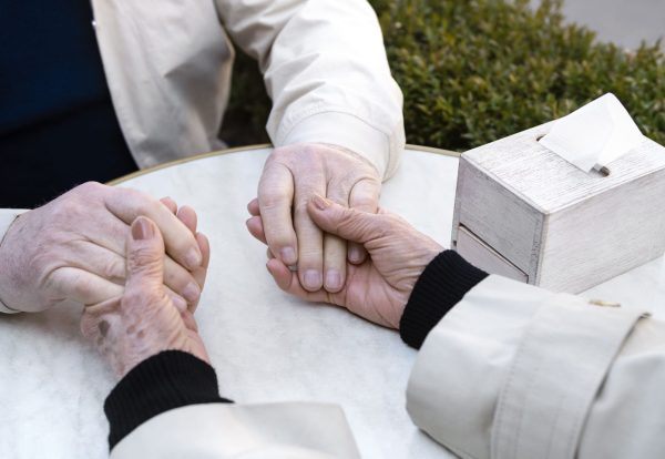 high-angle-old-people-holding-hands